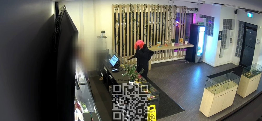 robber-wearing-wig-in-dispensary.jpg